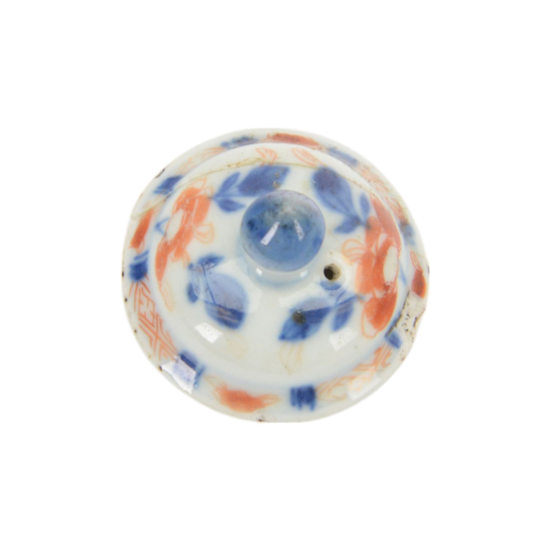18th century Chinese Imari coffee or chocolate pot, of tapering cylindrical form with side handle, and domed cover with knop finial, painted with a vase of flowers upon a table and scroll, amongst blossoming flowers, H12cm 