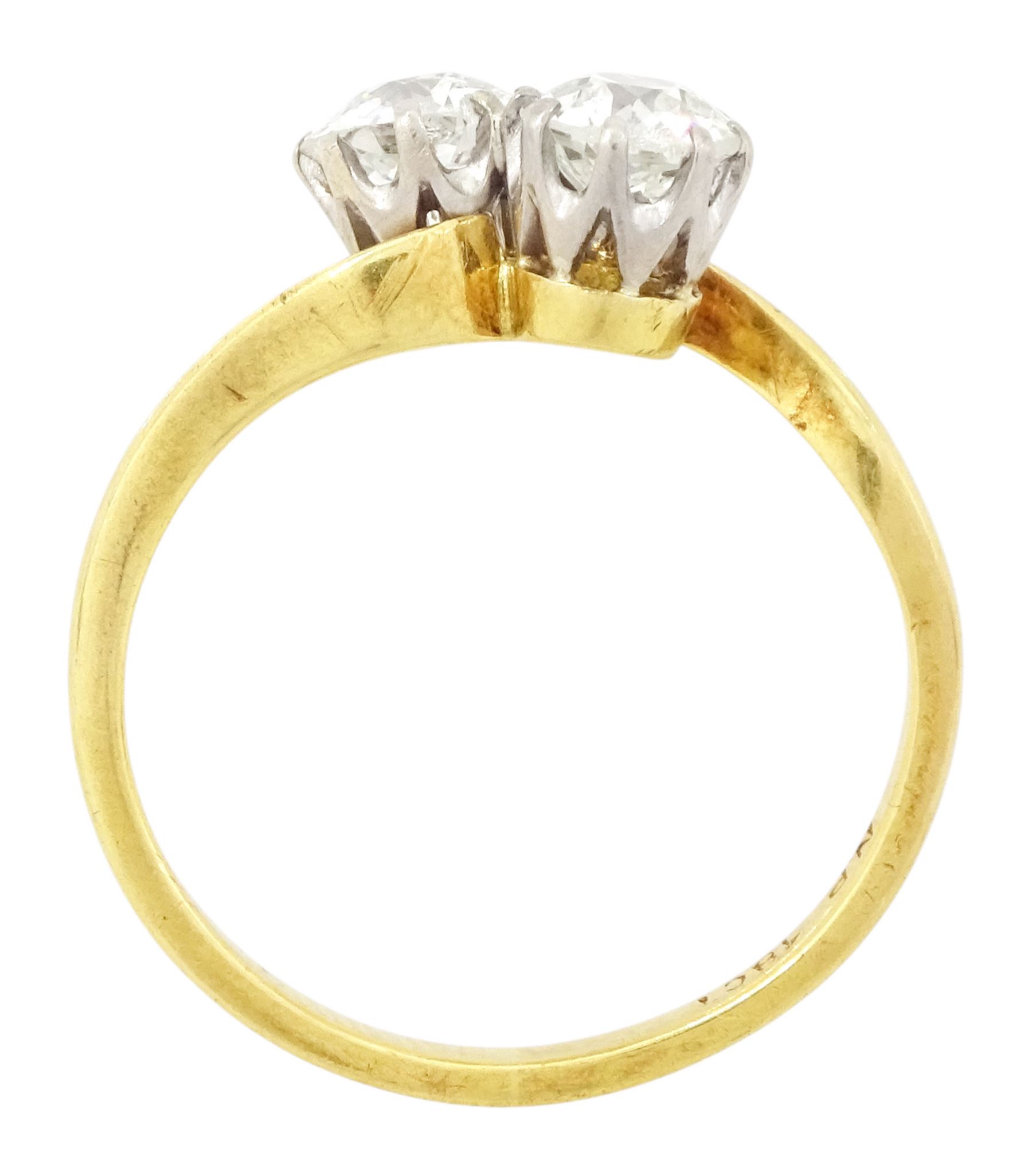 Gold diamond ring, crossover set with two old cut diamonds, stamped 18ct, total diamond weight approx 1.30 carat