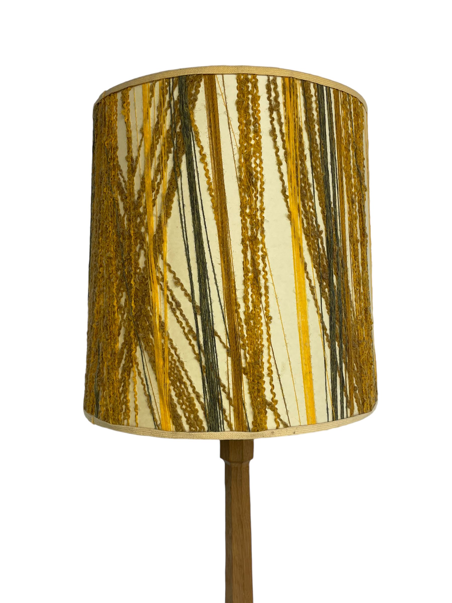 Mouseman - oak standard lamp, octagonal tapered column on octagonal base carved with mouse signature, by the workshop of Robert Thompson, Kilburn