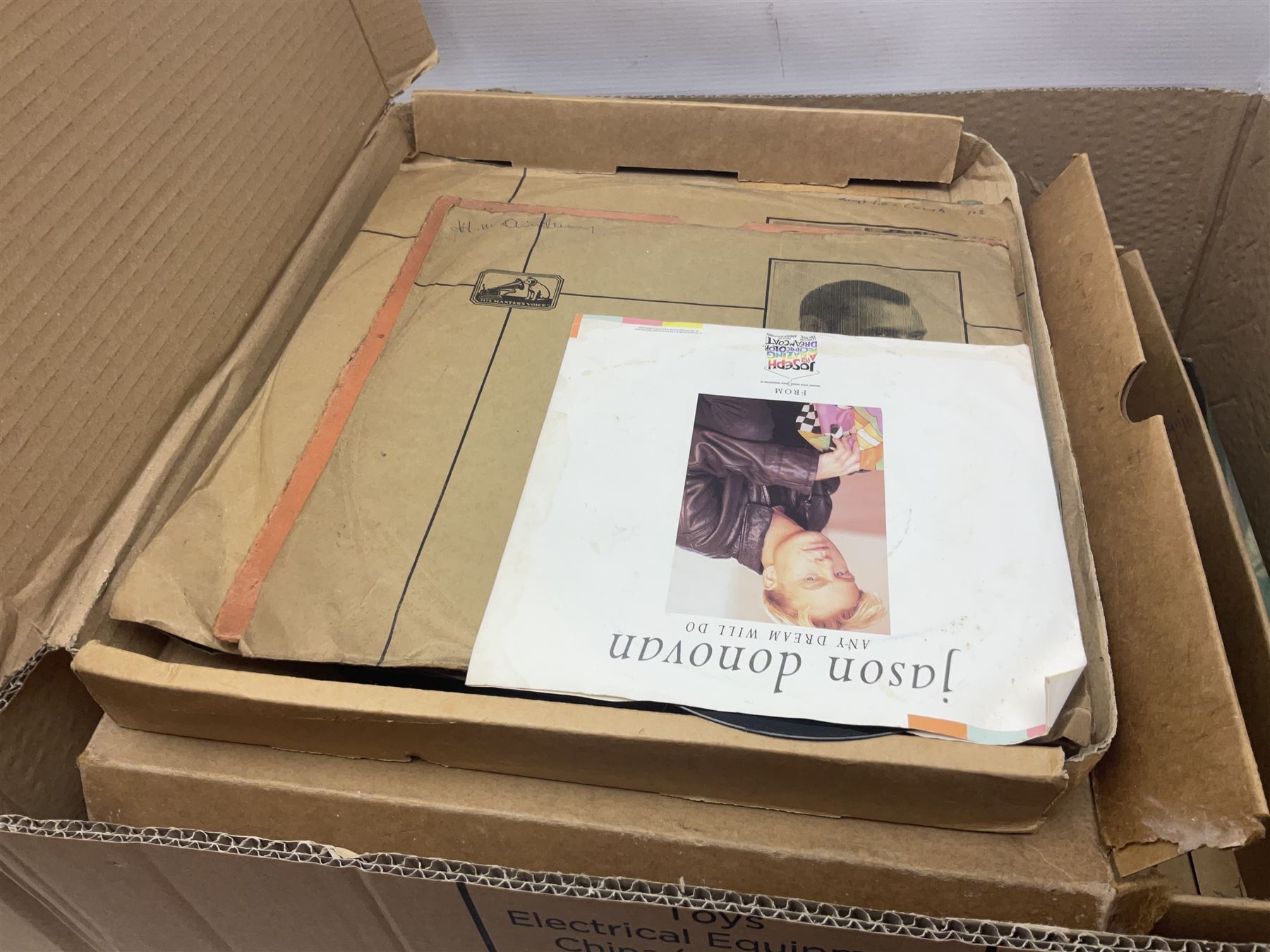 Clear glass demijohn / carboy, four wine bottles with wicker baskets, W T Avery & Co scales, Singer sewing machine, quantity of costume jewellery, trophy stand with silver-plate shields, quantity of vinyl records, stamps etc