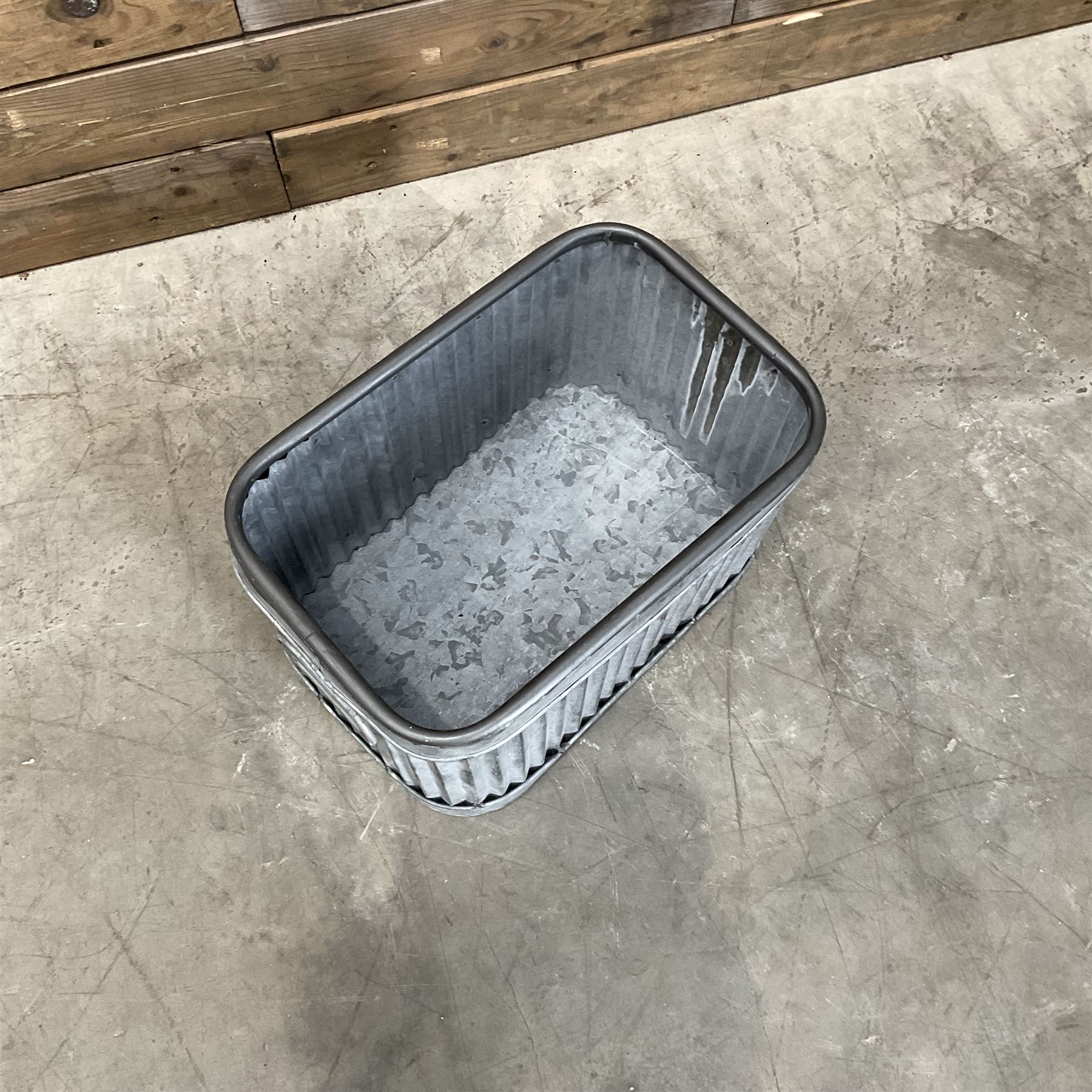 Set of three pressed metal planters in different sizes