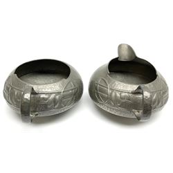 Archibald Knox for Liberty & Co Tudric pewter three piece tea service, comprising teapot with woven reed handle, single handled open sucrier, and milk jug, each with planished finish and detailed with honesty flowers, each impressed beneath Made in England Tudri Pewter 0231 