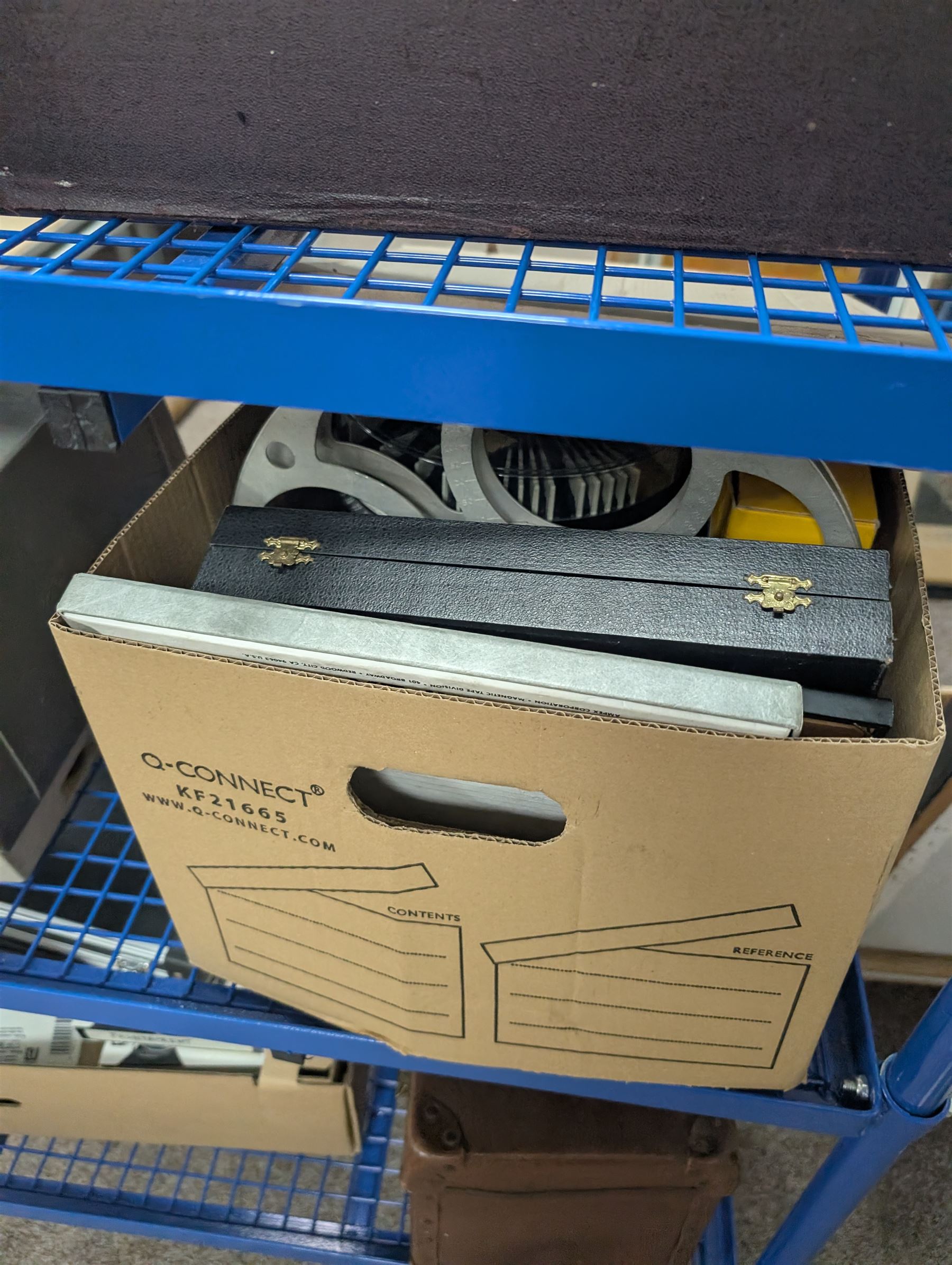 Collection of projectors, including Transpaque Junior overhead projector, Demo Comm 1 overhead projector, Bolex 18-9 Duo, Bolex 18-5, Pathescope Kid, Kodascope Model C, collection of video tapes and film reels, empty projector box, Kinay 816 editor, etc