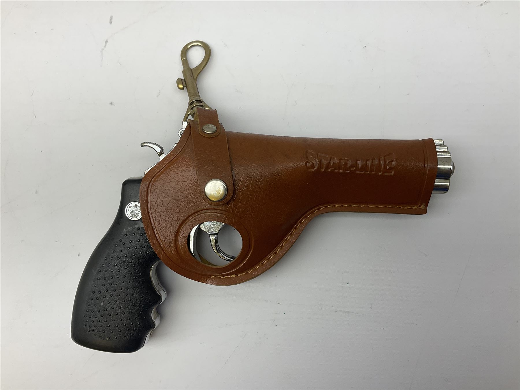 Early 20th century Flobert 5mm blank firing revolver with six-shot chamber, top venting, nickel plated with folding trigger No.118 L12.5cm overall; replica non-firing 'British Bulldog' revolver; and Windproof gas lighter inscribed 'Revolver-99 Spring and Autumn' in holster marked 'Star-Line'