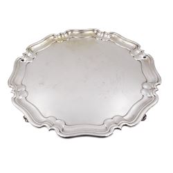 Mid 20th century silver salver, with pie crust rim, upon four scroll feet, hallmarked 	Atkin Brothers, Sheffield 1942, D26cm