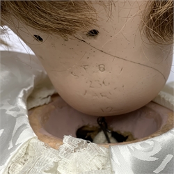 SFBJ 'Laughing Jumeau' bisque head doll with applied hair, sleeping brown eyes, open-closed mouth with teeth and tongue and composition body with jointed limbs, impressed marks 'SFBJ 236 Paris 12', H60cm    