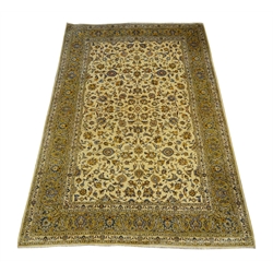  Persian Kashan pale gold ground rug carpet, the field decorated with trailing foliage and stylised flower heads, scroll patterned guarded border, 364cm x 242cm  