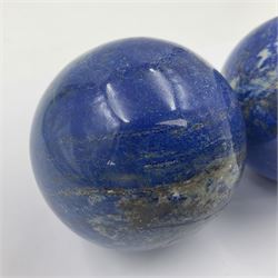 Pair of Lapis lazuli spheres, upon a carved stone stands, D8cm