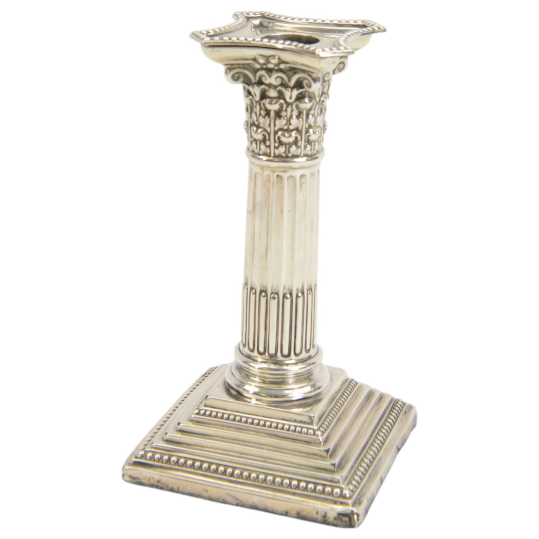 Pair of early 20th century silver Corinthian column candlesticks, upon square stepped filled bases, hallmarked Walter Latham & Son, Sheffield 1913, H16cm