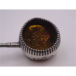 Late 19th century American silver strainer, the bowl of circular part fluted form, with foliate embossed detail, gilt interior with pierced strainer, and foliate detailed handle to side, marked beneath Sterling 925/1000, with makers mark for Foster & Bailey, L11cm, approximate weight 0.86 ozt (26.7 grams)
