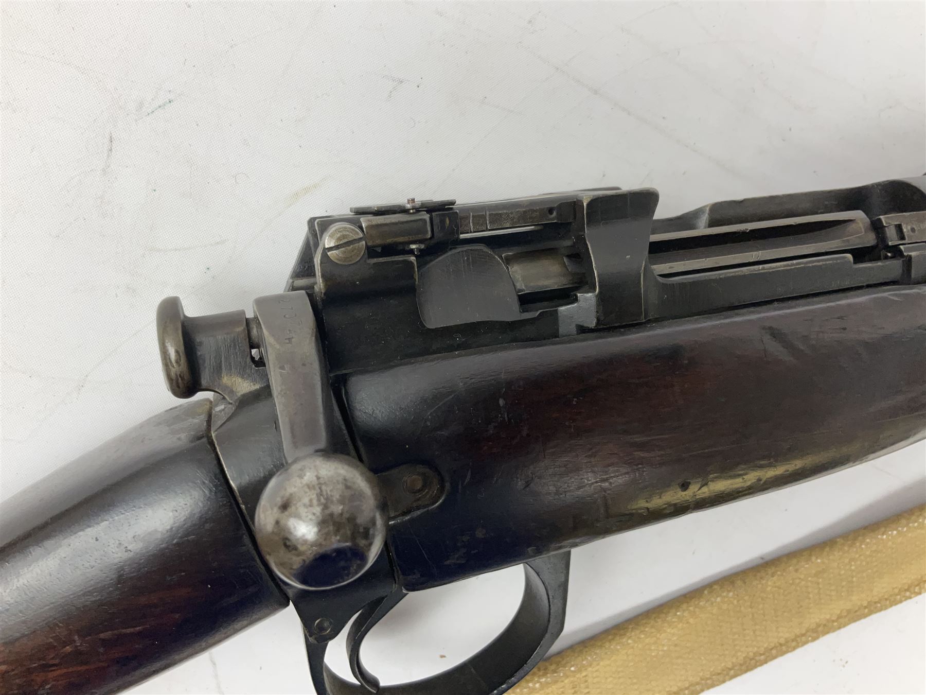 Lee Enfield SMLE .303 No.4 Mk.1* bolt action rifle with 63.5cm barrel and original webbing sling; lacking magazine; No.75C8419; L111cm overall; deactivated to early specification so requires re-deactivation to modern standards SECTION 1 RFD ONLY