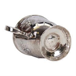 George I silver porringer, of typical form with flat capped twin curved handles,  the body with later presentation engraving surrounded by later embossed foliate decoration, upon a spreading circular foot, hallmarked Sarah Holaday, London 1723, H10.5cm