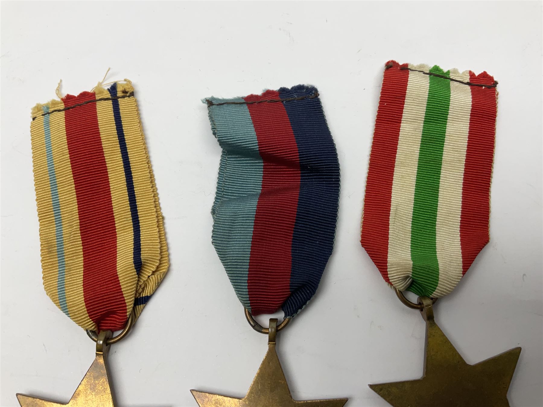 Group of five WWII medals comprising 1939-45 War Medal, Defence Medal and Italy, Africa and 1939-45 Stars; all with ribbons (5)