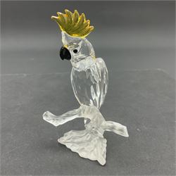 Four Swarovski Crystal bird figures, comprising Cockatoo, pair of Hoopoes on a branch, four Lovebirds on a branch and four Hummingbirds on a branch, largest H10cm