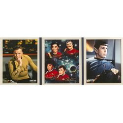 Limited edition Star Wars print 'The Voyage Begins' by Stewart Robinson numbered 516/1701, framed above three signed photographs of William Shatner as Captain James T. Kirk, Leonard Nimoy as Mr Spock and The Star Trek Legendary Four, all with certificates of authenticity verso, frame H109cm, W90cm
