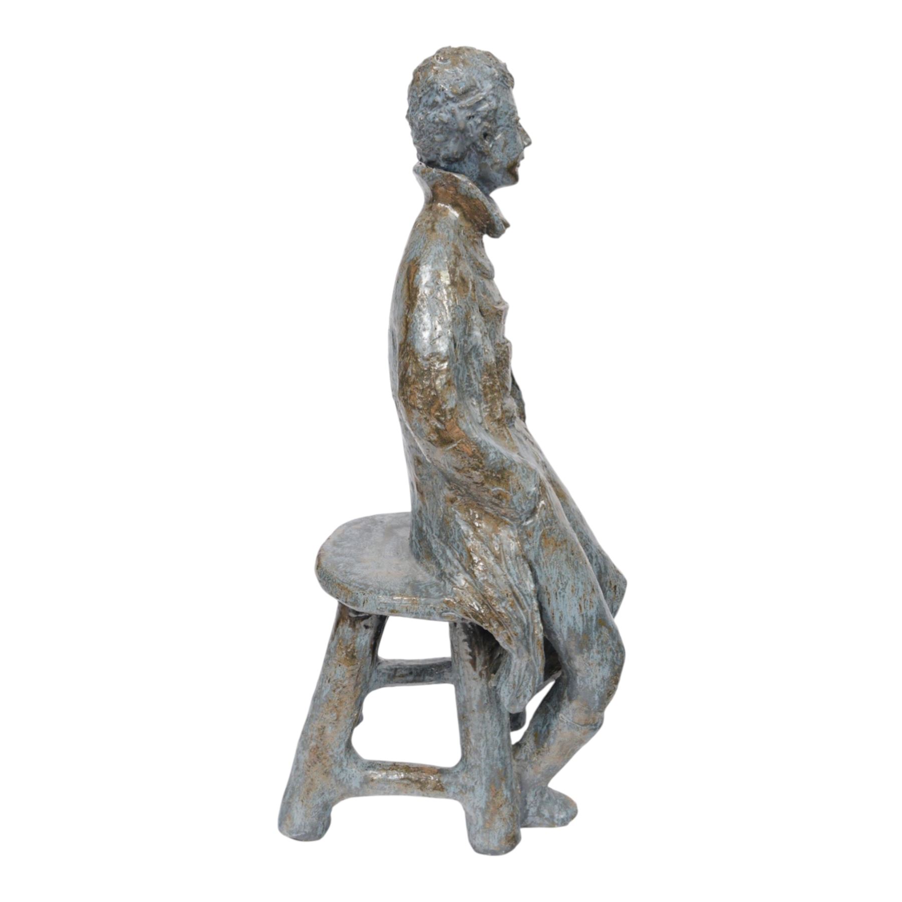 Studio pottery figure, modelled as a boy seated upon a stool, H68cm 
