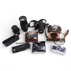 Collection of cameras, lenses and accessories, including Panasonic Lumix DMC-G2, Koroll 24...