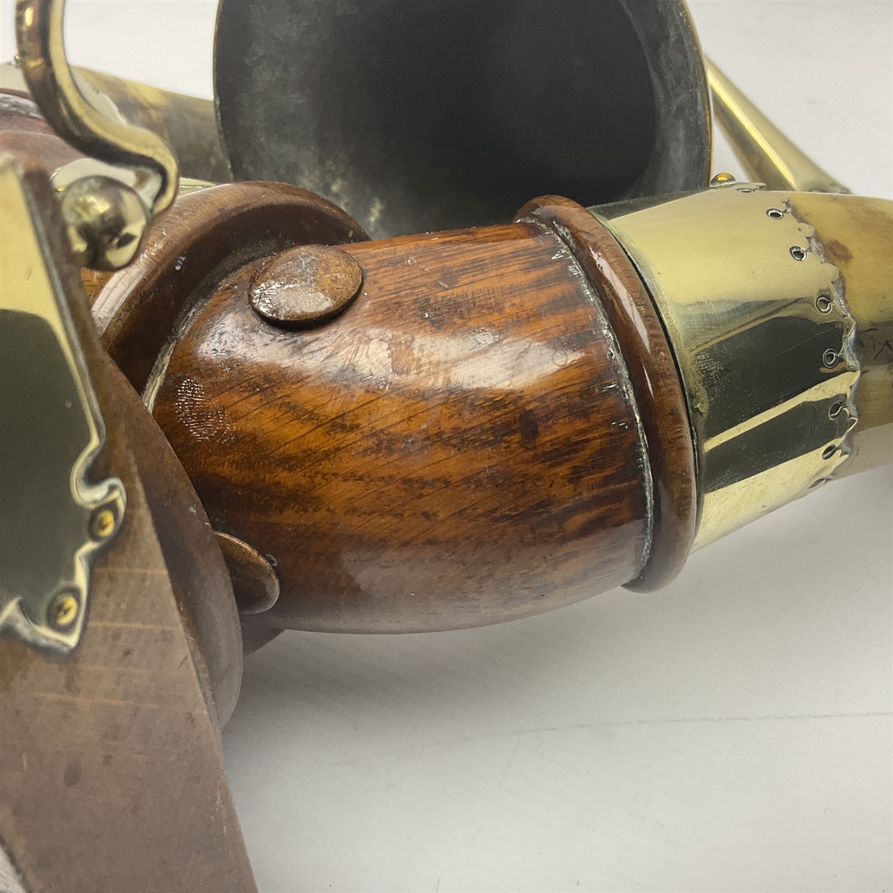 Early 20th century oak and horn dinner bell, the silvered bell suspended from a pair of cow horns, with silver plated mounts and blank shield shaped cartouche, upon square base, H37cm
