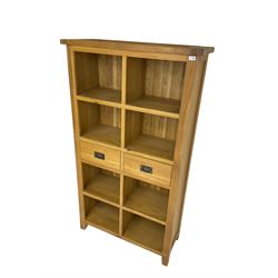 Light oak eight compartment bookcase with two drawers