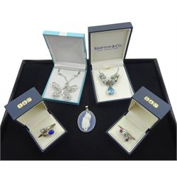 Collection of silver jewellery including butterfly pendant necklace, blue and white agate cat pendant, topaz and opal necklace, emerald, ruby and sapphire ring and a lapis lazuli and topaz ring, all stamped 925
