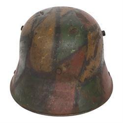 WWI German camouflage M16 helmet, with camouflage painted finish to the skull in green, brown and ochre colours with black separation lines