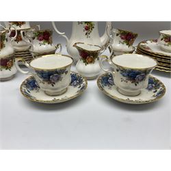 Royal Albert Old Country Roses pattern tea and dinner wares, comprising teapot, six teacups and six saucers, two larger teacups, six side plates, two dinner plates, open sucrier and milk jug, together with two Royal Albert Moonlight Rose pattern teacups and saucers. 