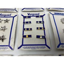 Fifty US rank badges and trade badges; WW2 and Vietnam period; predominantly on sale cards