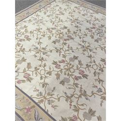 French style Aubusson rug, the pale ground field decorated with interlacing foliage and flower heads, repeating border 