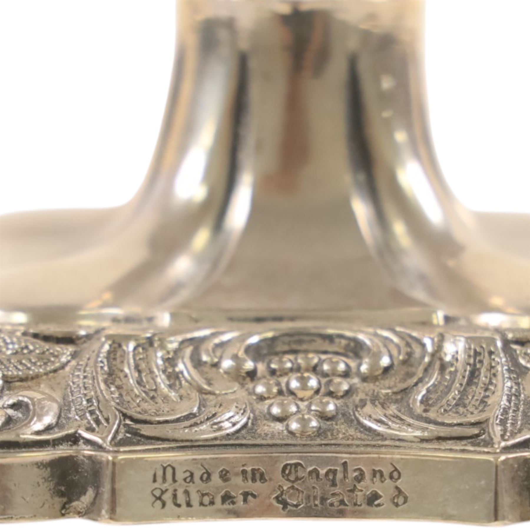 Silver plate two branch candelabra with grape vine decoration to the base, together with a matching pair of candle sticks and other candlesticks  