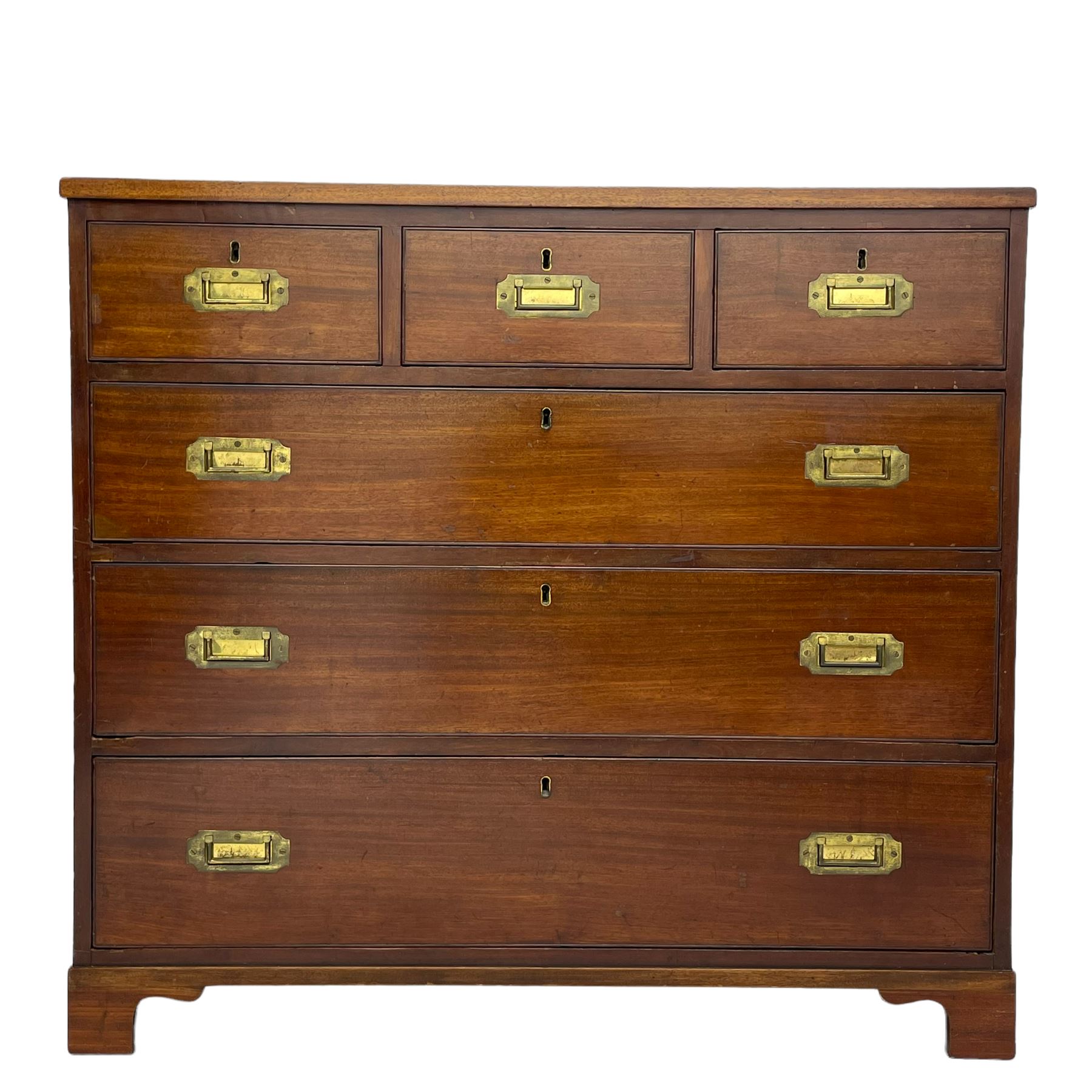 Georgian military type campaign chest, narrow rectangular top over three short and three long drawers, recessed brass handles, on bracket feet