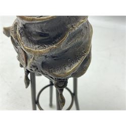 Art Deco style bronze modelled as a female figure seated upon a chair holding an apple, after 'Pierre Collinet', H28cm