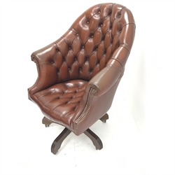 Library style swivel reclining desk chair, upholstered in deep buttoned and studded brown leather, five shaped supports, W78cm