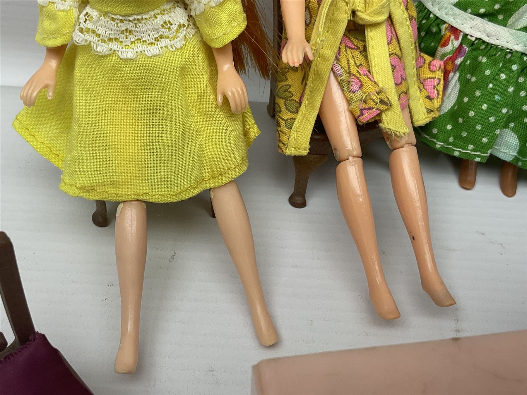 Seven Pippa dolls and a collection of plastic dolls house furniture