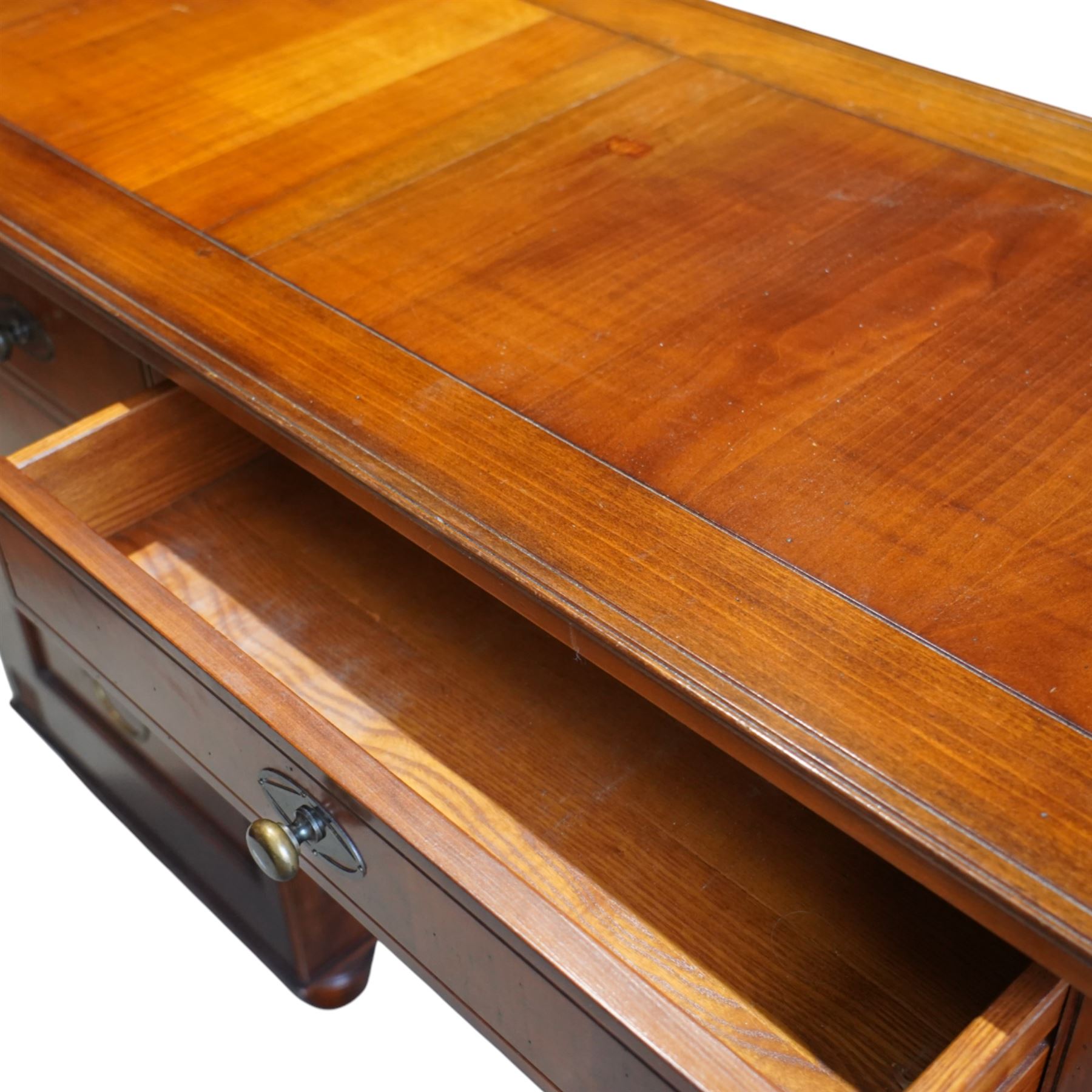 And So To Bed - French cherry wood twin pedestal dressing table, the rectangular top over seven drawers arranged with a central drawer and three drawers to each pedestal, panelled sides with louvred detail, raised on turned bun feet