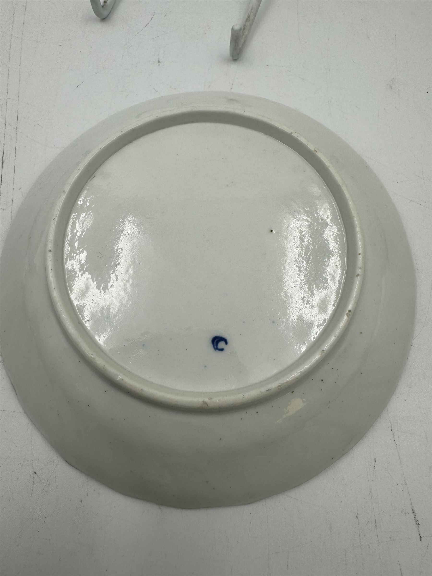 18th century Caughley blue and white sparrow jug, decorated in the Mother and Child pattern, circa 1780-1790, with underglaze C mark beneath, H9cm, together with a Worcester coffee cup, circa 1785 painted with floral sprays in underglaze blue and gilt, with crescent mark beneath, and a Caughley trio of tea cup, tea bowl and saucer, each of moulded wrythen fluted form and decorated with gilt and blue sprigs and bands, each with crescent mark beneath, (5)