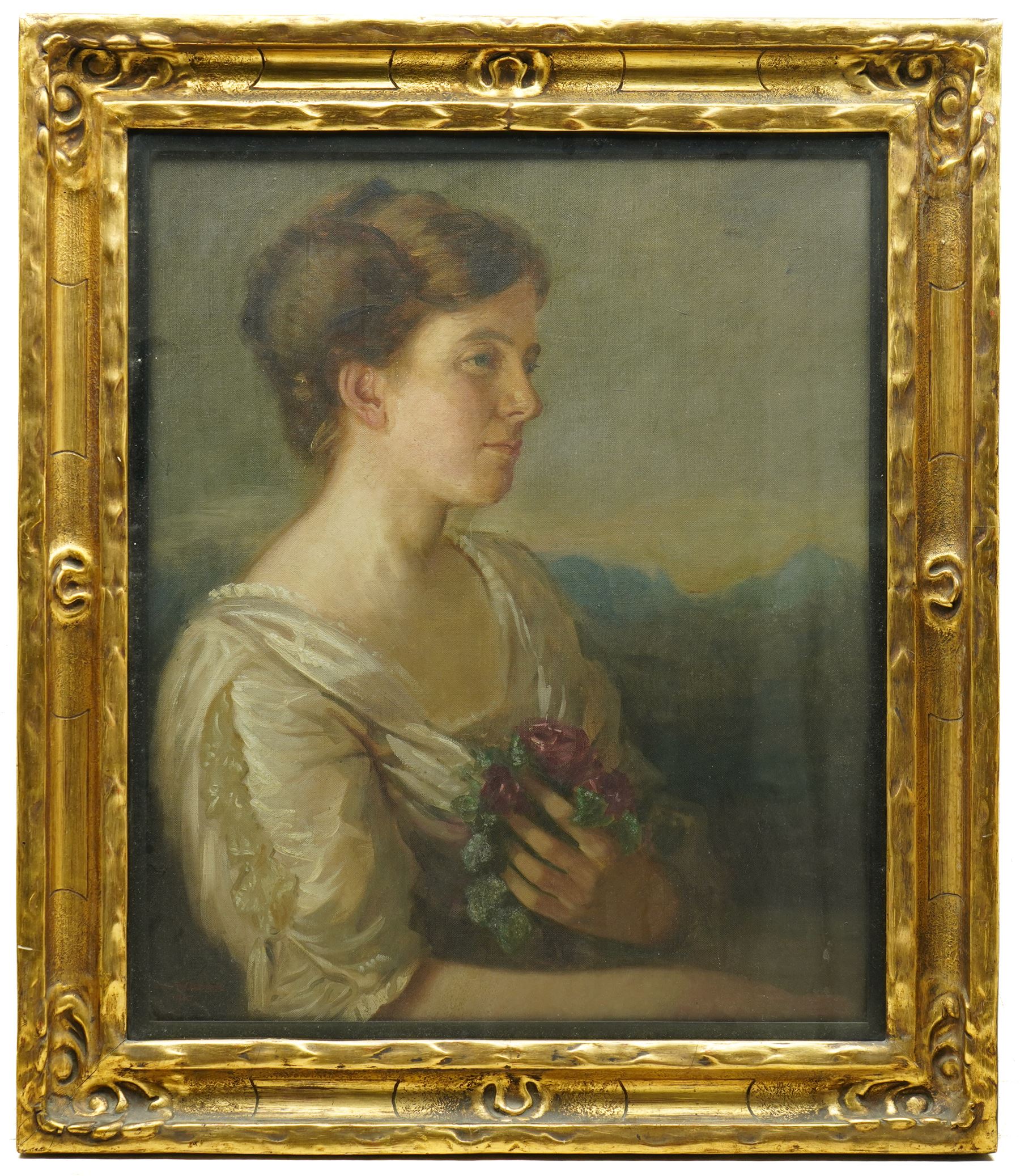 Eric B George (British 19th/20th Century): Portrait of an Edwardian Lady Holding Roses, oil on canvas signed and dated 1910, 60cm x 50cm