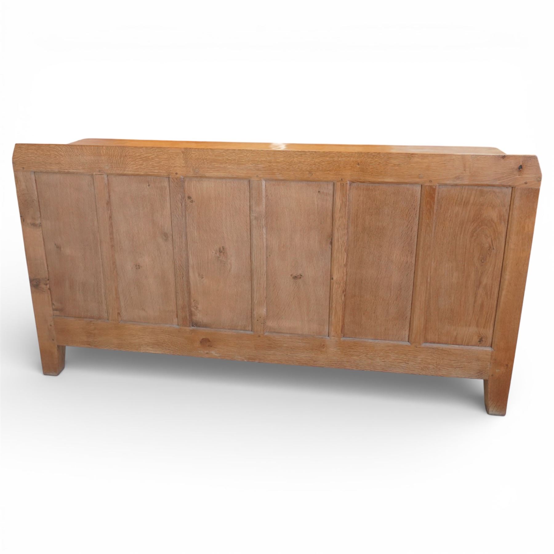 Rabbitman - oak sideboard adzed top with galleried top, with three graduating drawers to the centre, flanked by two panelled and lightly adzed doors, iron latches and hinges, raised on tapered stile supports, with carved rabbit signature, by Peter Heap of Wetwang   