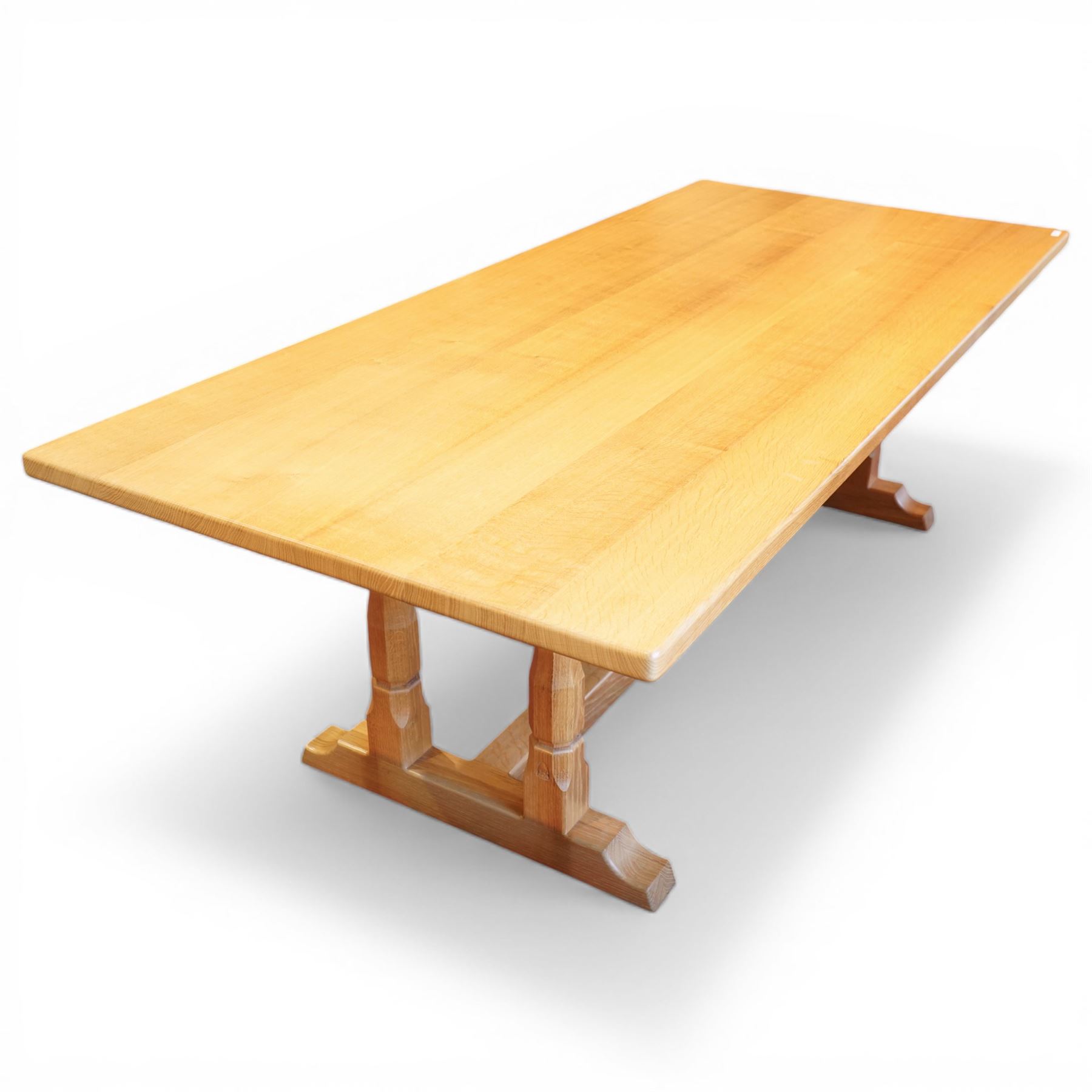 Knightman - oak rectangular refectory four pillar dining table, rectangular plank top, over twin pillar supports to both ends, united by a single stretcher with sled feet, with carved knight signature, by Horace Knight of Thirsk