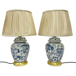 Pair of table lamps of baluster form, decorated with exotic birds upon fruiting trees, on gilt pedestals, including shades H55cm