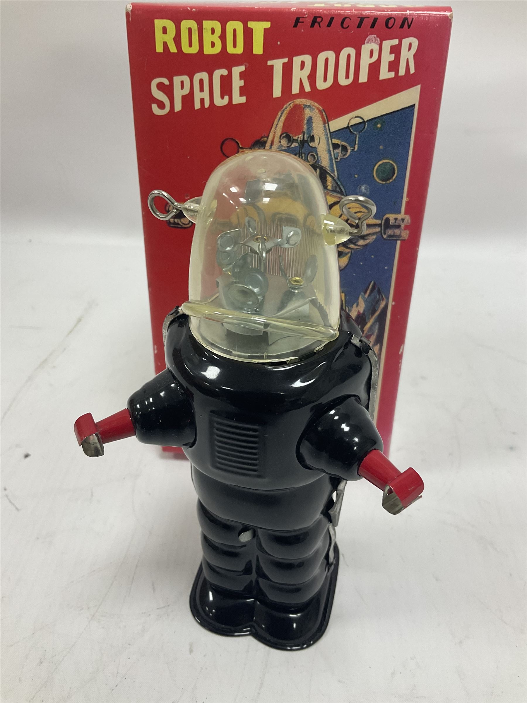 Three vintage battery operated robots comprising tin-plate Space Walk Man ME 100 Robot, Saturn the 13