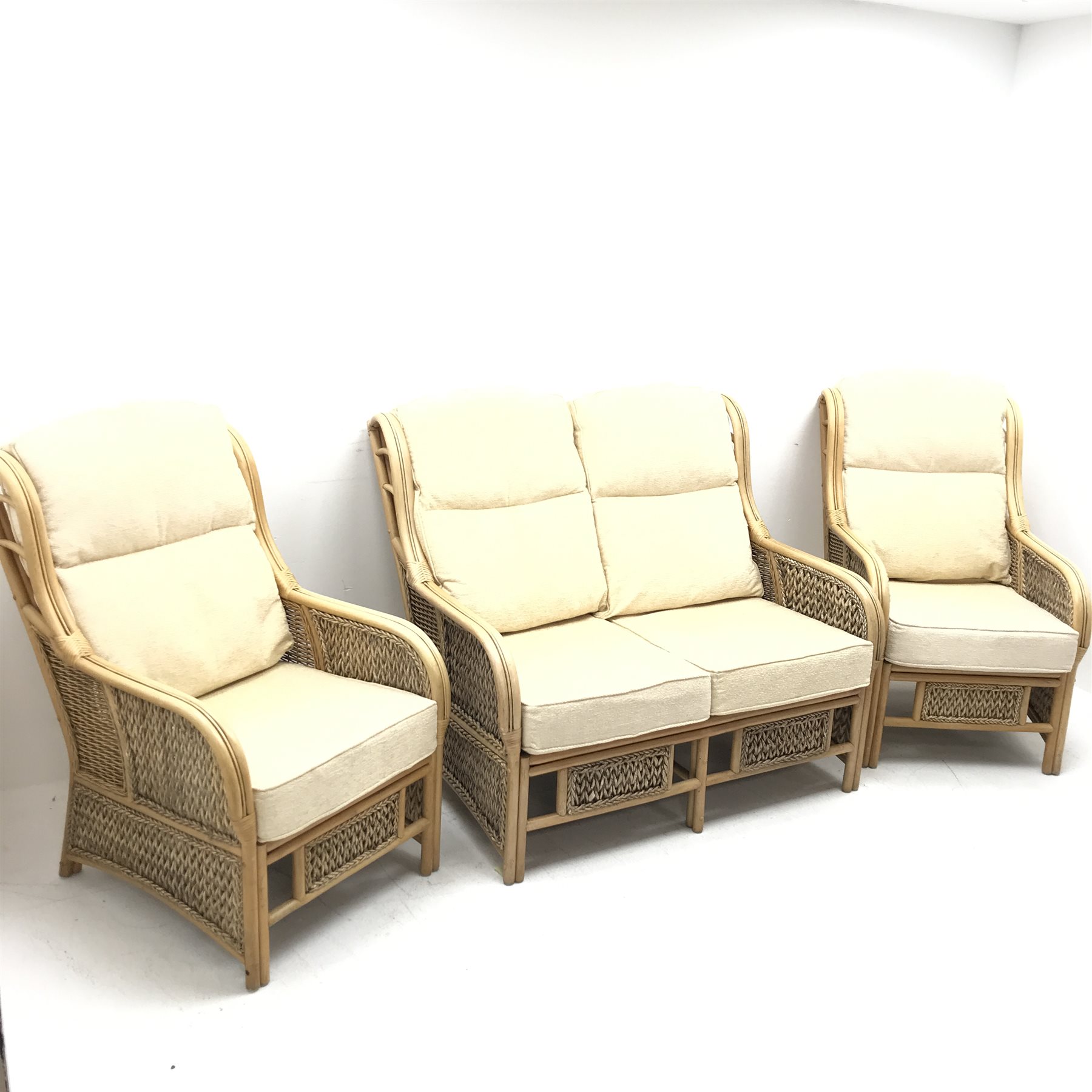 Two seat cane and bamboo conservatory sofa, cushions upholstered in