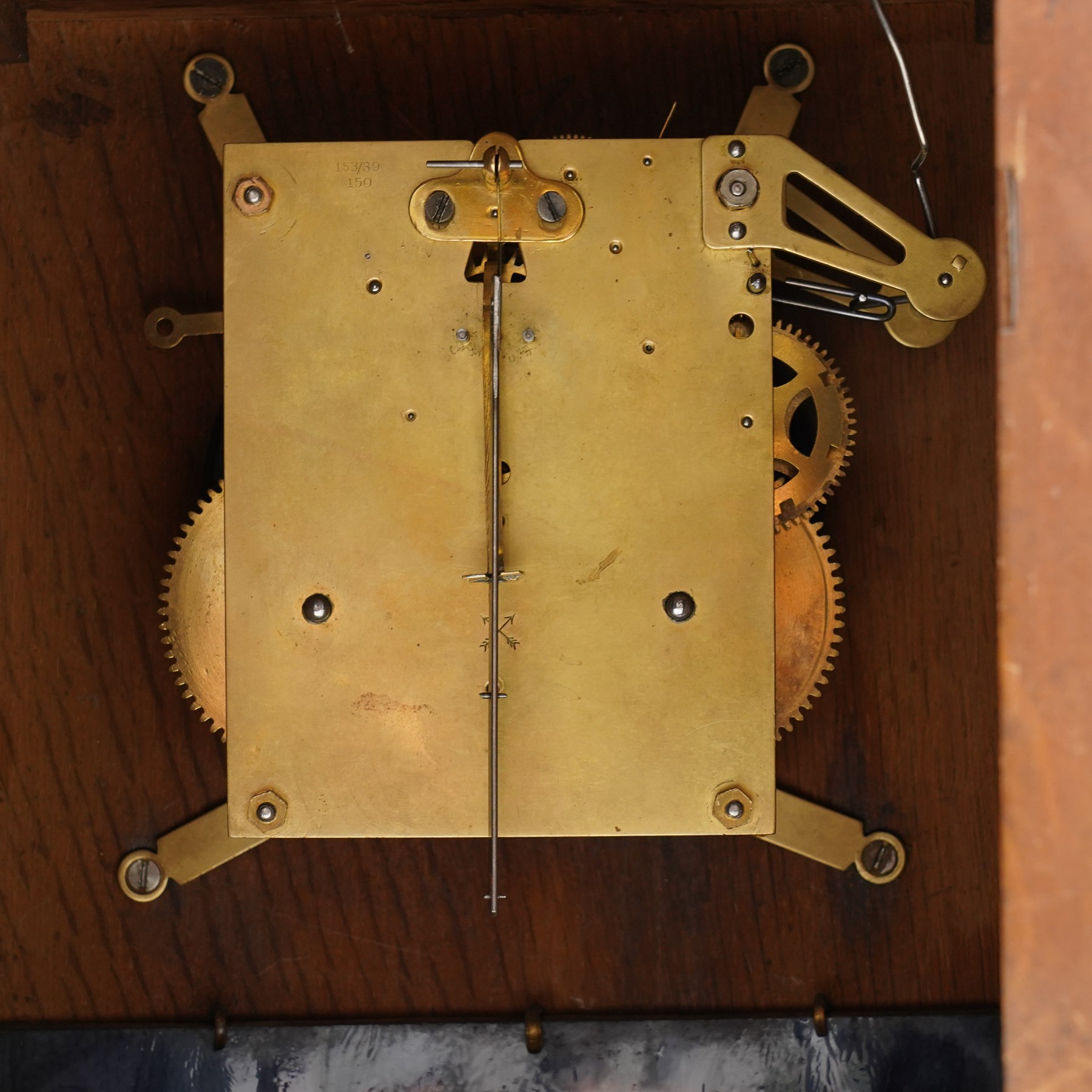 Arts and Crafts oak and brass mounted mantel clock, Hamburg-American Clock Company (HAC), for Liberty & Co, the eight day movement with bell strike, repousse dial with Arabic numerals H36.5cm

  