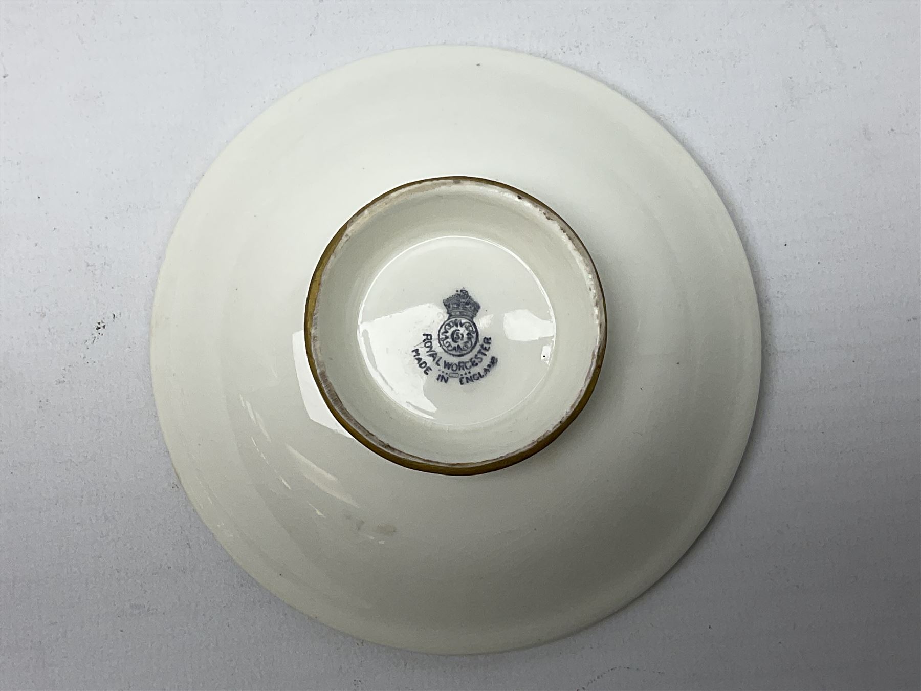 1938 Royal Worcester circular pedestal pin dish, decorated with pheasants in a landscape by James Stinton, with printed mark beneath, D10.5cm