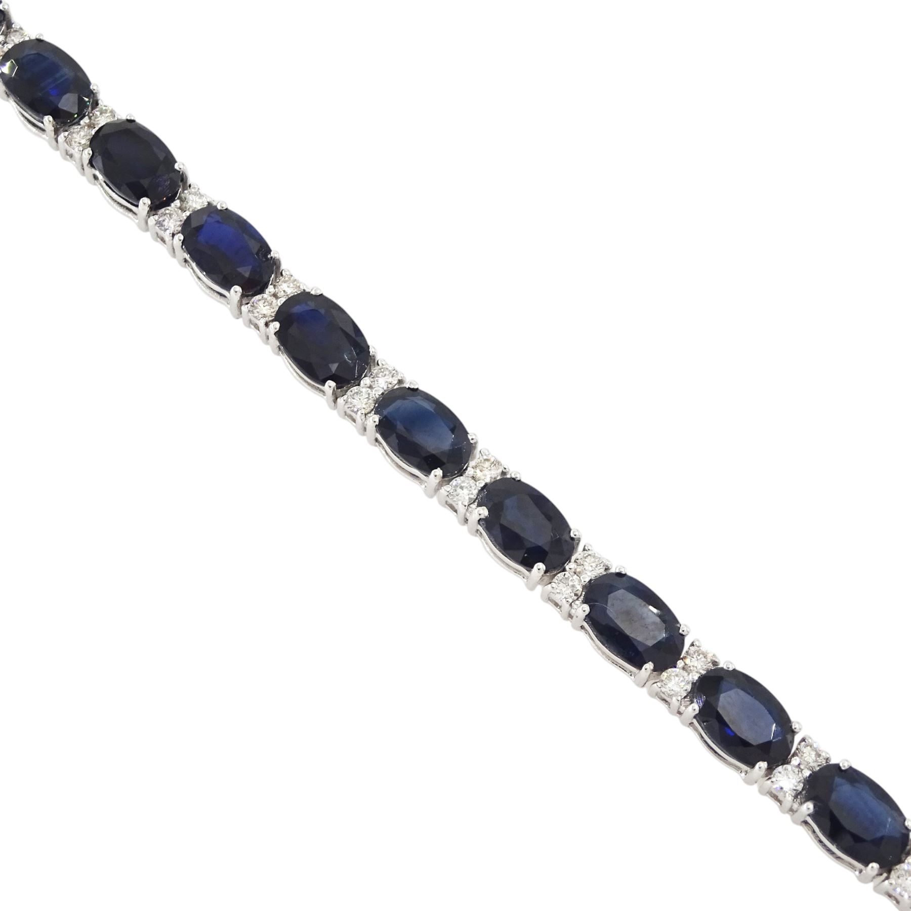 18ct white gold sapphire and diamond bracelet, twenty-three oval cut sapphires, each spaced by two round brilliant cut diamonds, stamped 750, total sapphire weight 14.785 carat, total diamond weight 0.88 carat