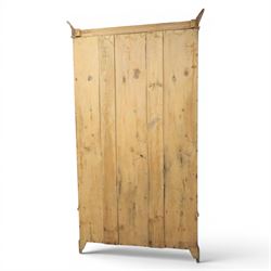 Traditional waxed pine single wardrobe, featuring single panelled door above base drawer, loop handles