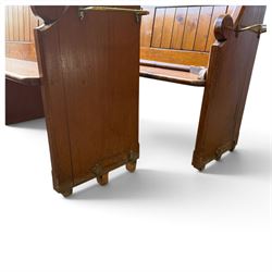 Set of four early 20th century single-ended stained pine ecclesiastical church pews, the shaped end support flanking slatted and panelled back