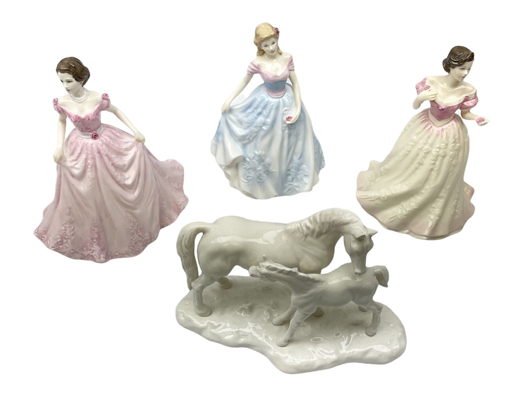 Three Royal Doulton figures, comprising Faith HN4151, Hope HN4097 and Charity HN4243, together with a horse and foal figure group