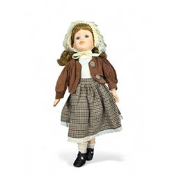 Porcelain doll, dressed in a brown checked skirt and cord jacket, stamped 9510 A to neck, H46cm