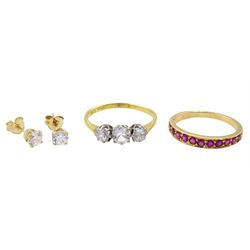 18ct gold ruby half eternity ring, 18ct gold three stone paste stone set ring and a pair of 14ct gold cubic zirconia stud earrings
