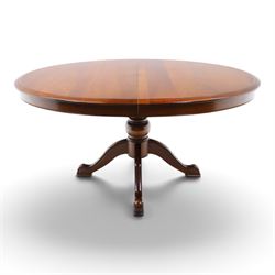 Barker & Stonehouse - cherrywood oval extending dining table and four upholstered chairs, the table with additional leaf extended to cm, raised on a turned column above swept supports, the chairs with brown upholstery and multi-coloured geometric design